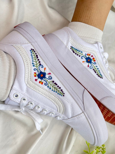 White Embroidered Flower Symbol